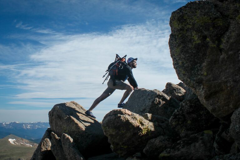 Mountain climber reaching a summit — illustrating the UPSC Mains essay topic Courage to Accept and Dedication to Improve Are Two Keys to Success.