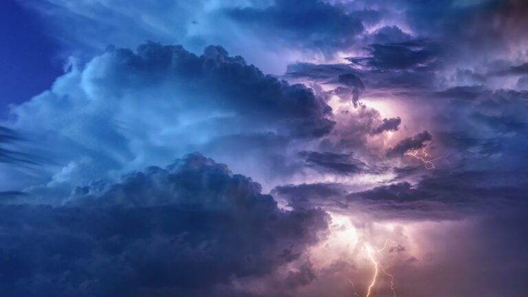 Lightning storm over a darkened landscape — visual metaphor for the UPSC Mains essay topic We May Brave Human Laws but Cannot Resist Natural Laws