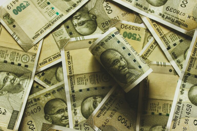 UPSC Mains essay topic Impact of new economic measures on fiscal ties between the union and states in India — Indian rupee banknotes close-up.