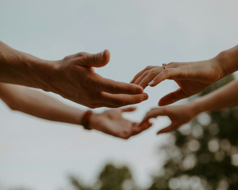 UPSC Mains essay topic Life Is a Long Journey Between Human Being and Being Humane — diverse hands reaching out together symbolising shared humanity.