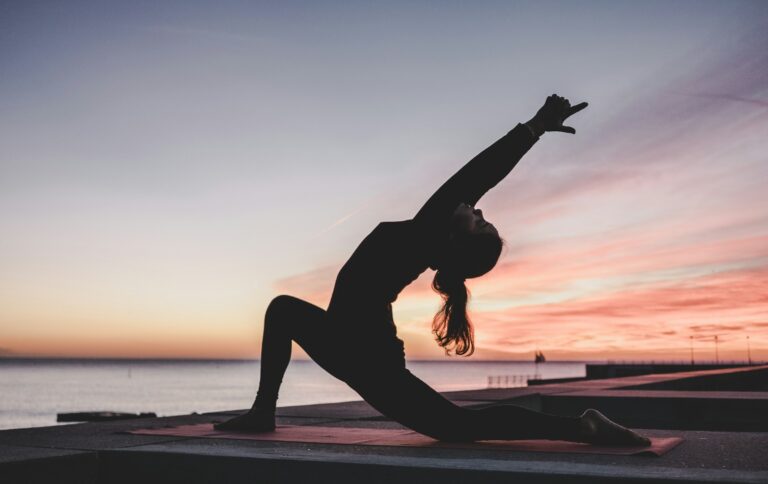 Silhouette of a person practising yoga at sunrise — UPSC Mains essay topic Mindful manifesto is the catalyst to a tranquil self