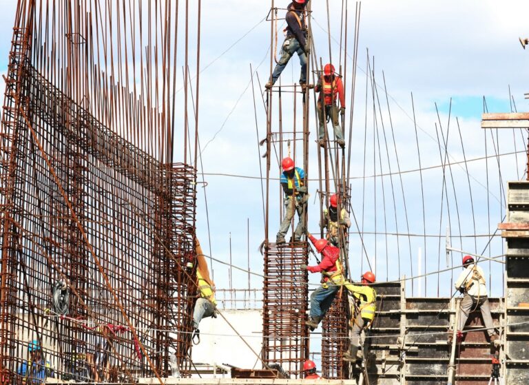 UPSC Mains essay topic near jobless growth in India — construction workers on an Indian building site