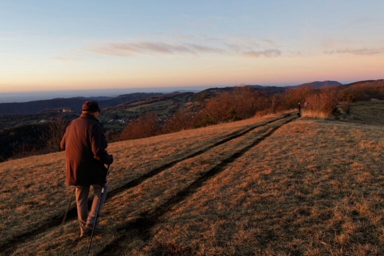 UPSC Mains essay topic Not All Who Wander Are Lost — lone walker on a mountain path at sunset