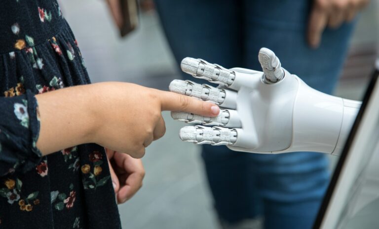 UPSC Mains essay topic Rise of Artificial Intelligence — human and robotic hand
