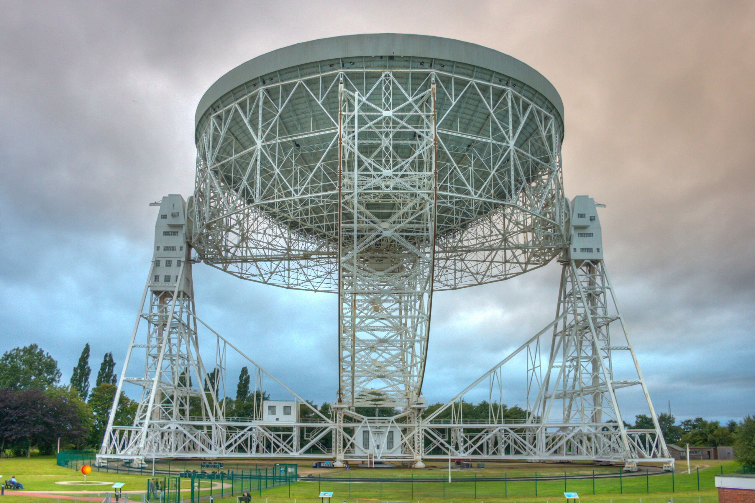 The large white dish of the Lovell radio telescope at Jodrell Bank Observatory against the sky
