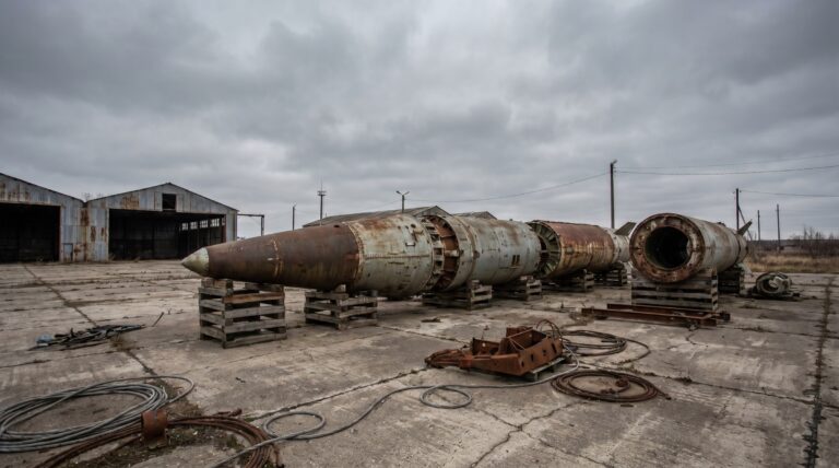 A dismantled intermediate-range missile on a concrete apron under grey sky