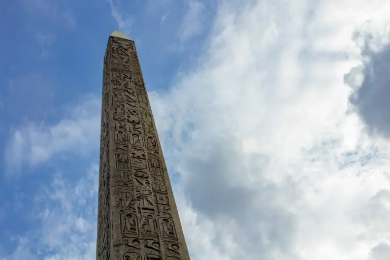 A tall stone memorial pillar against an open sky