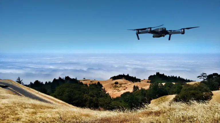 A military drone in flight against open sky