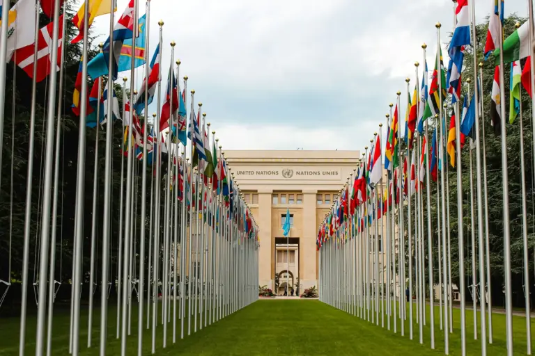 National flags flying outside a diplomatic venue