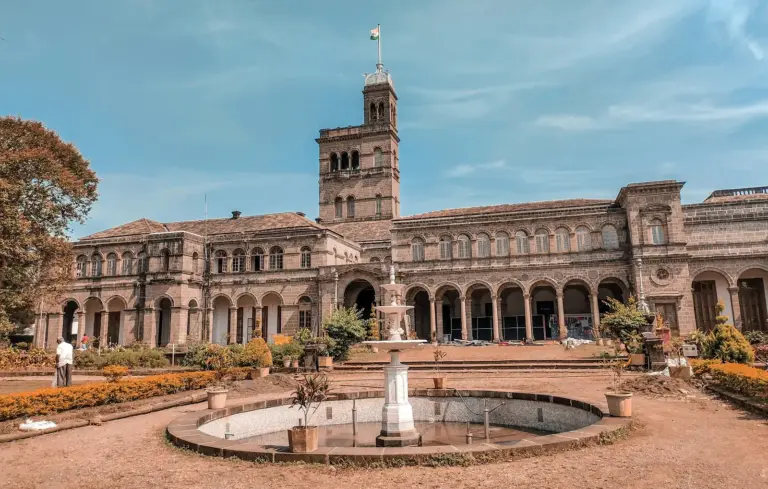 A colonial-era government house behind its gates