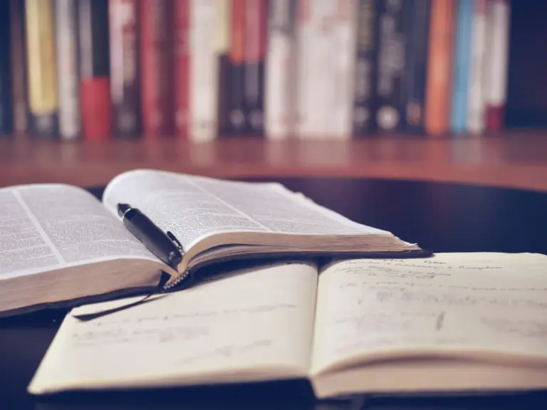 Open philosophy volumes on a reading desk