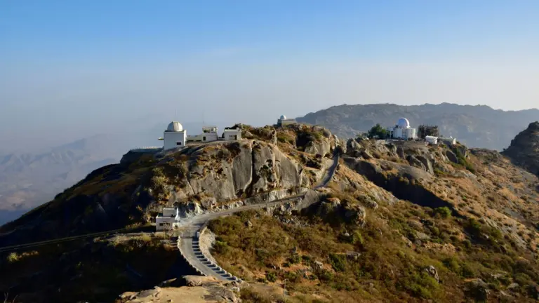 White Jain temples on a forested hill summit