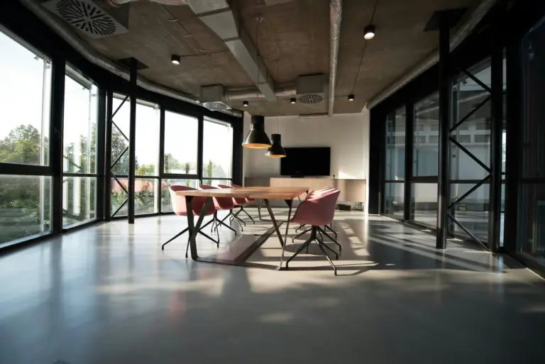 A boardroom table set for a governing-body meeting