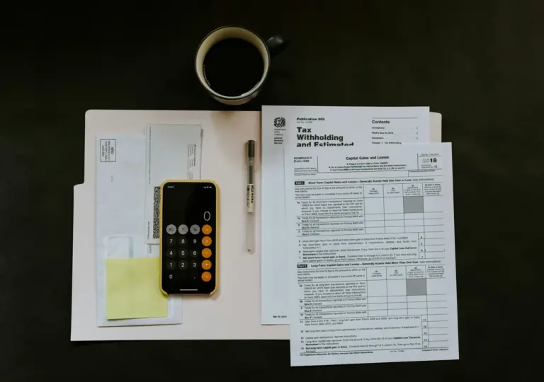 Budget statements beside a calculator