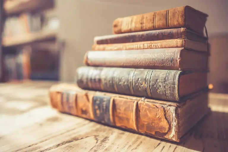 A stack of old leather-bound history books. Photo by Chris Lawton on Unsplash via Unsplash.