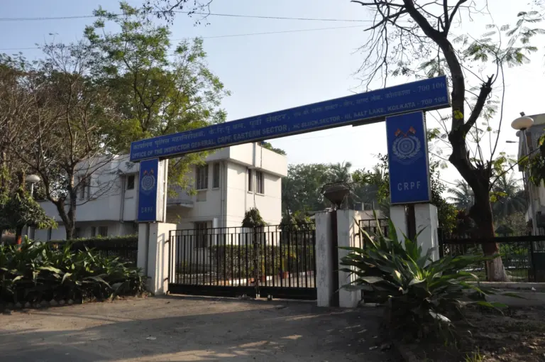 Entrance gate of a Central Reserve Police Force office in Salt Lake, Kolkata, under a blue signboard arch