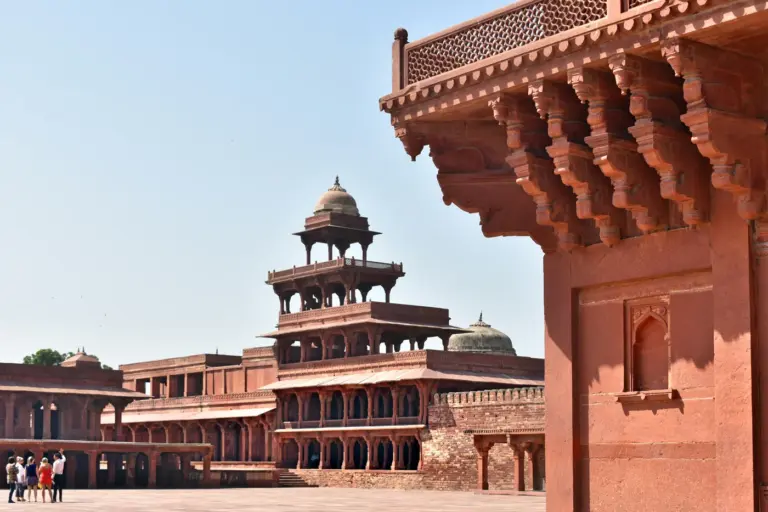 The five-storey Panch Mahal at Fatehpur Sikri, framed by a carved red sandstone pavilion in the foreground