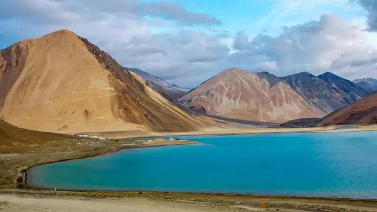 Turquoise Pangong Tso lake ringed by barren brown mountains in eastern Ladakh