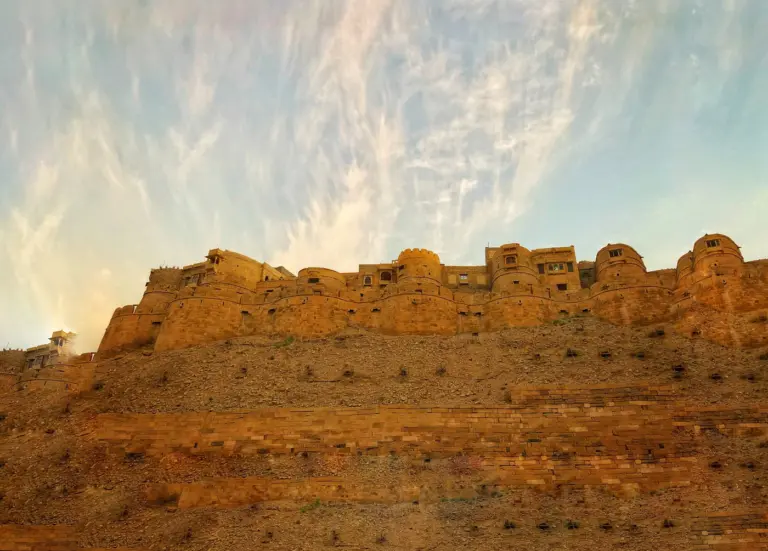 Jaisalmer Fort's golden-yellow stone walls and round bastions on Trikuta hill above the town of Jaisalmer