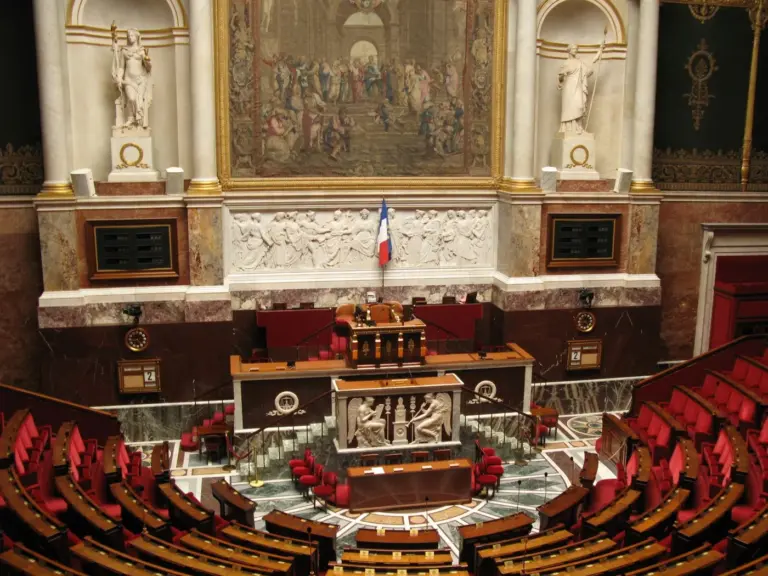 The semicircular chamber of France's National Assembly in Paris, with tiers of red benches facing the rostrum