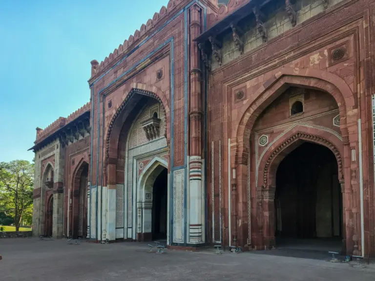 Arched red sandstone and marble facade of Sher Shah Suri's Qila-i-Kuhna mosque in Purana Qila, Delhi