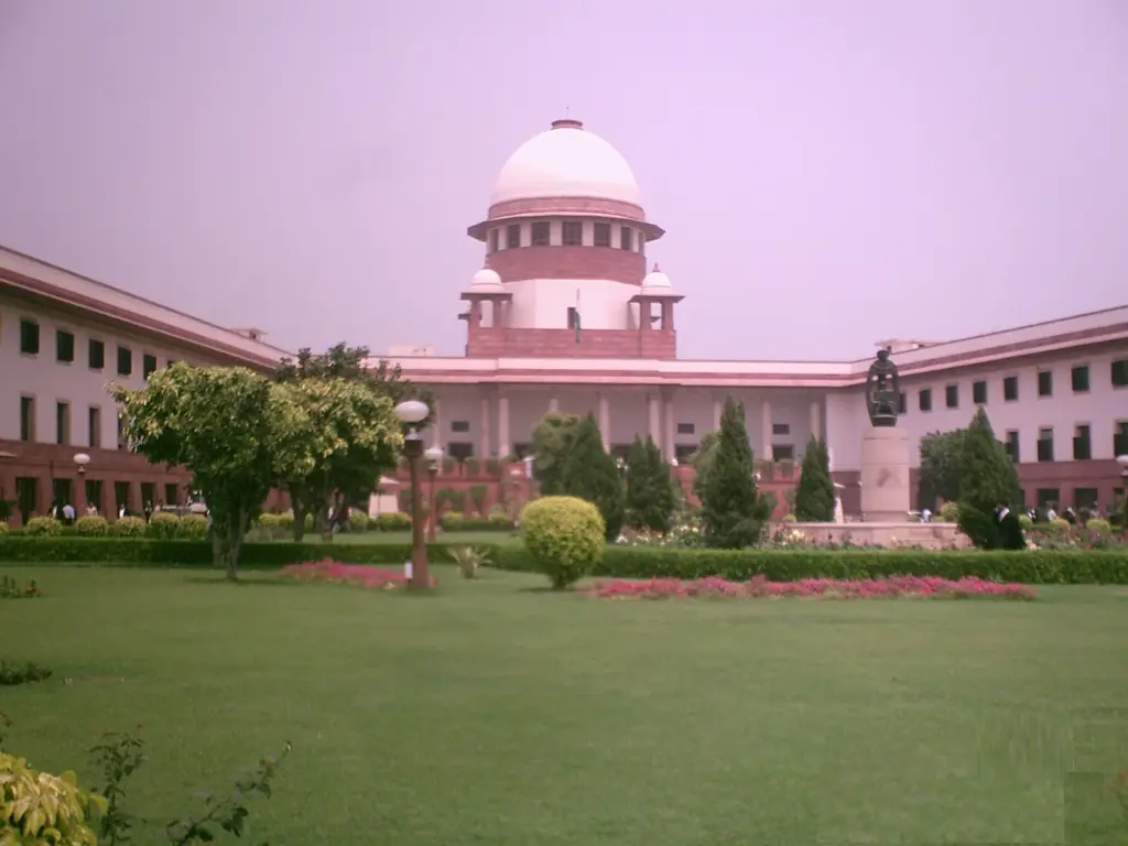 The domed main building of the Supreme Court of India in New Delhi seen from its front lawns.