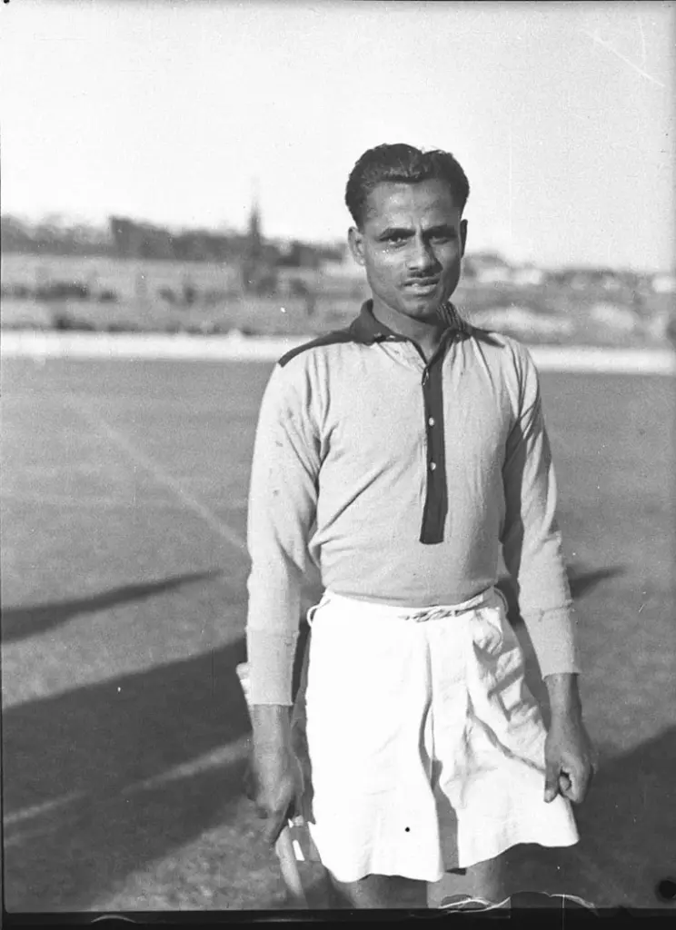 Black-and-white photograph of Dhyan Chand in his hockey kit on a playing field in Sydney in August 1935, when he captained the touring Indian team.