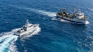 Illustrative fishing boat and patrol vessel at safe separation in Pacific waters