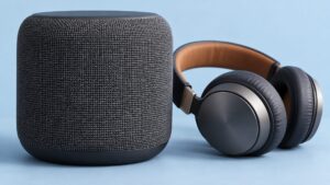 Illustrative compact loudspeaker and headphones for listening to generated speech