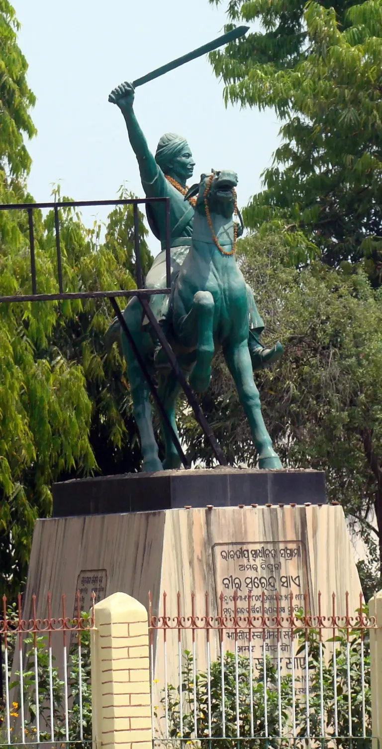 Green equestrian statue of Veer Surendra Sai raising a sword, on a stone pedestal in Sambalpur.